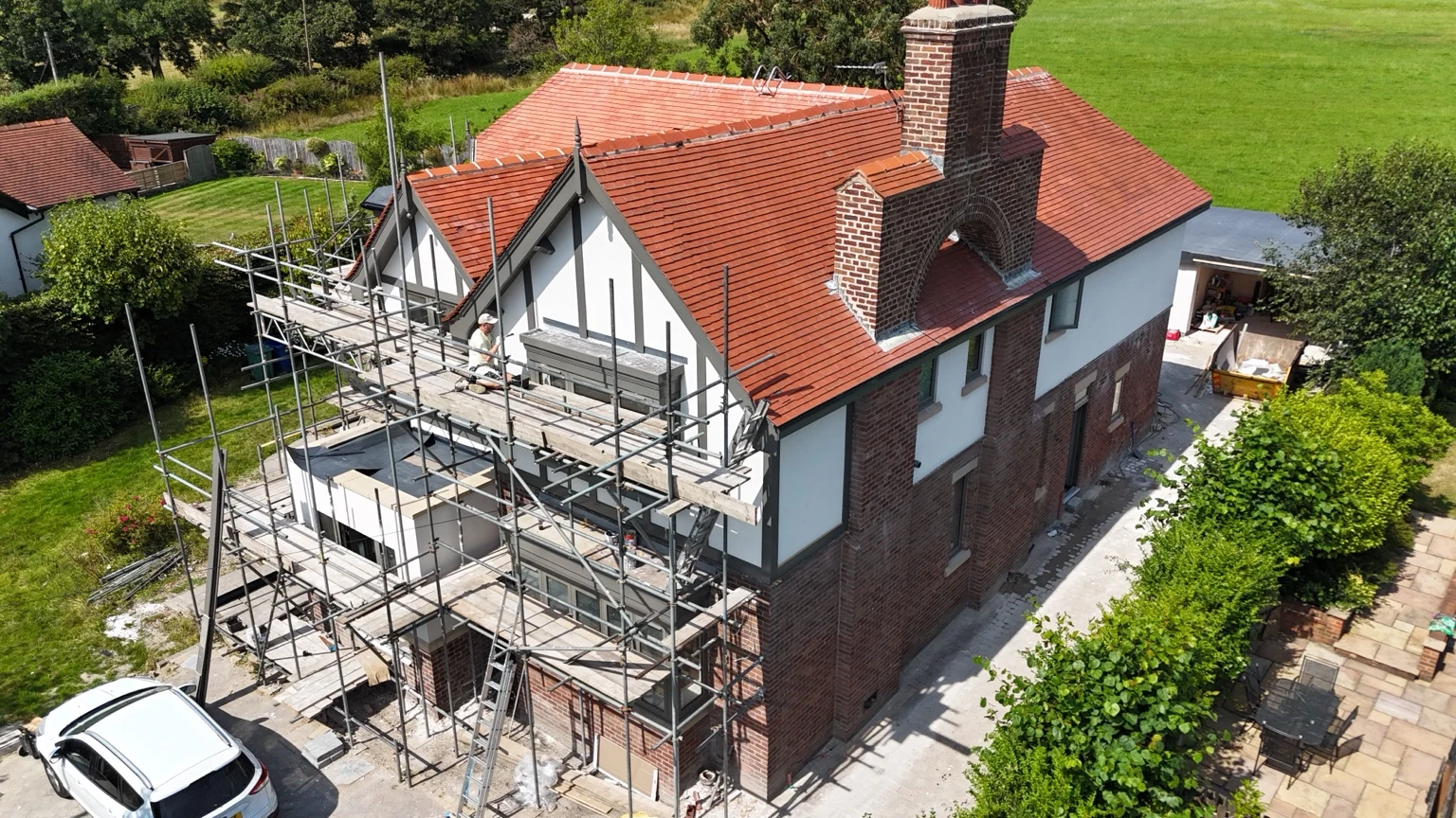 HOME project with scaffolding surrounding its front and side elevations